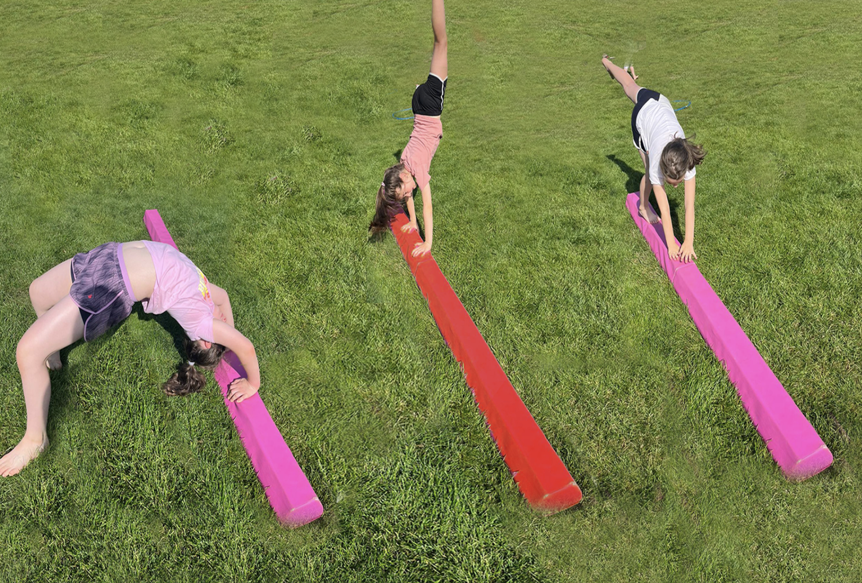 Gymnastics with three young girls on balance beams 