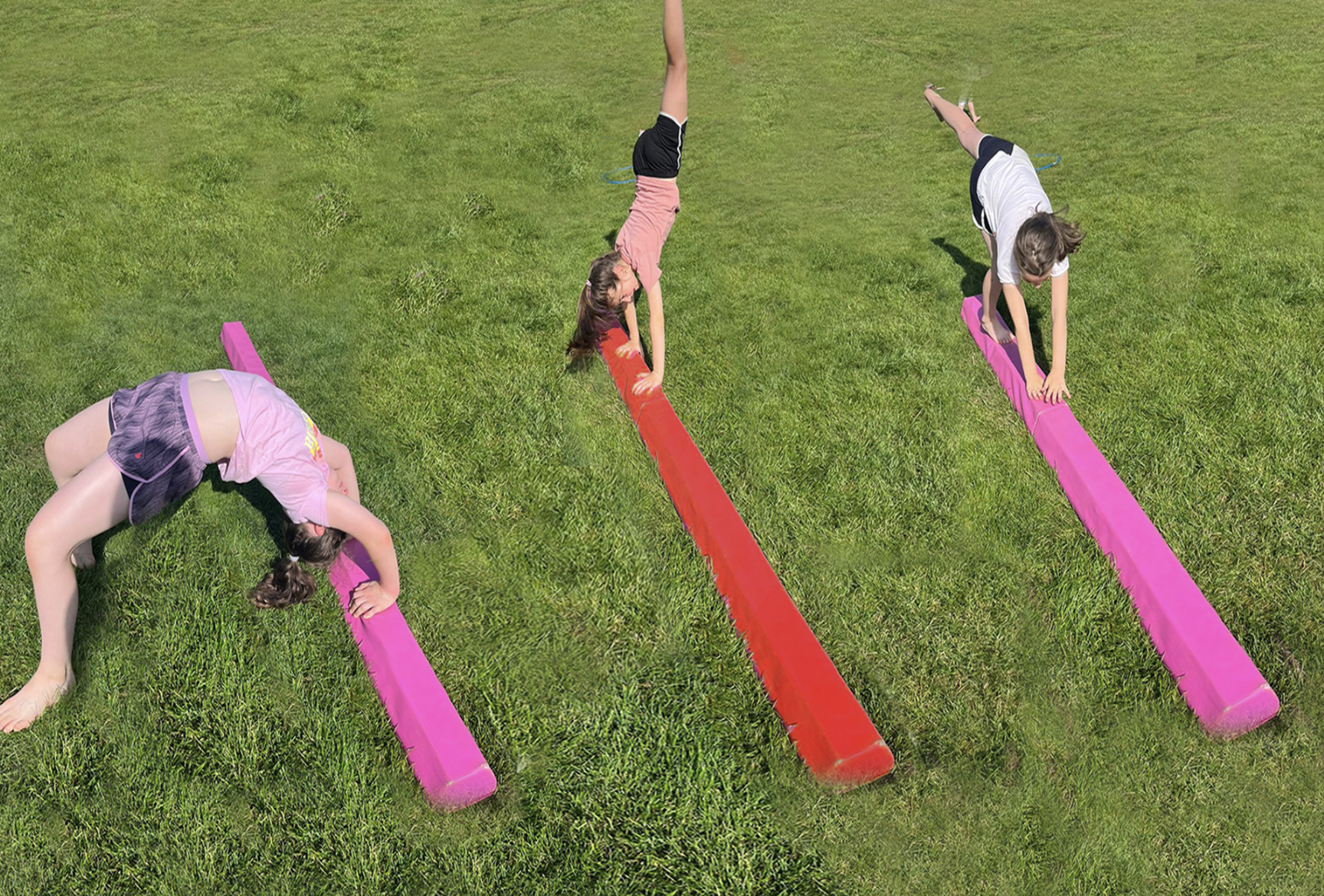 Gymnastics with three young girls on balance beams